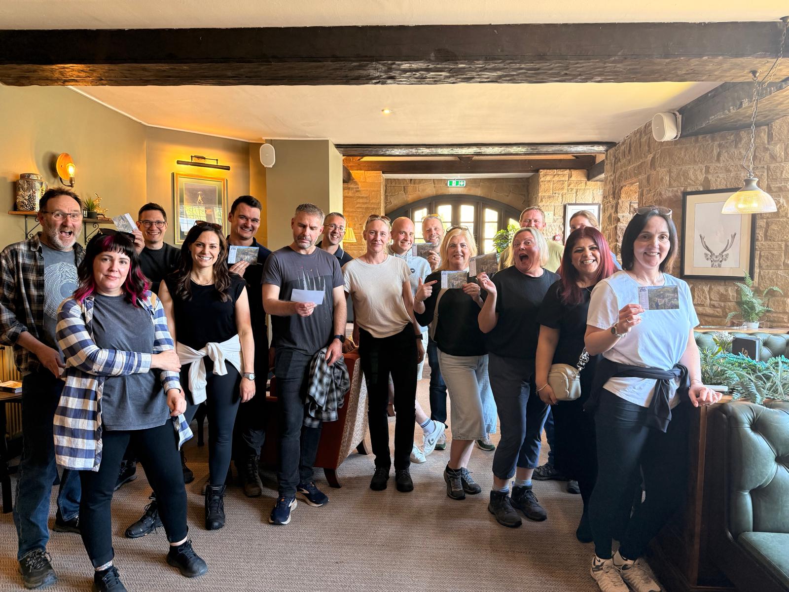 A large group of colleagues stood in a hotel