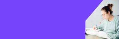 Two students sitting in a park on the grass with coffee and laptops Woman drinking coffee